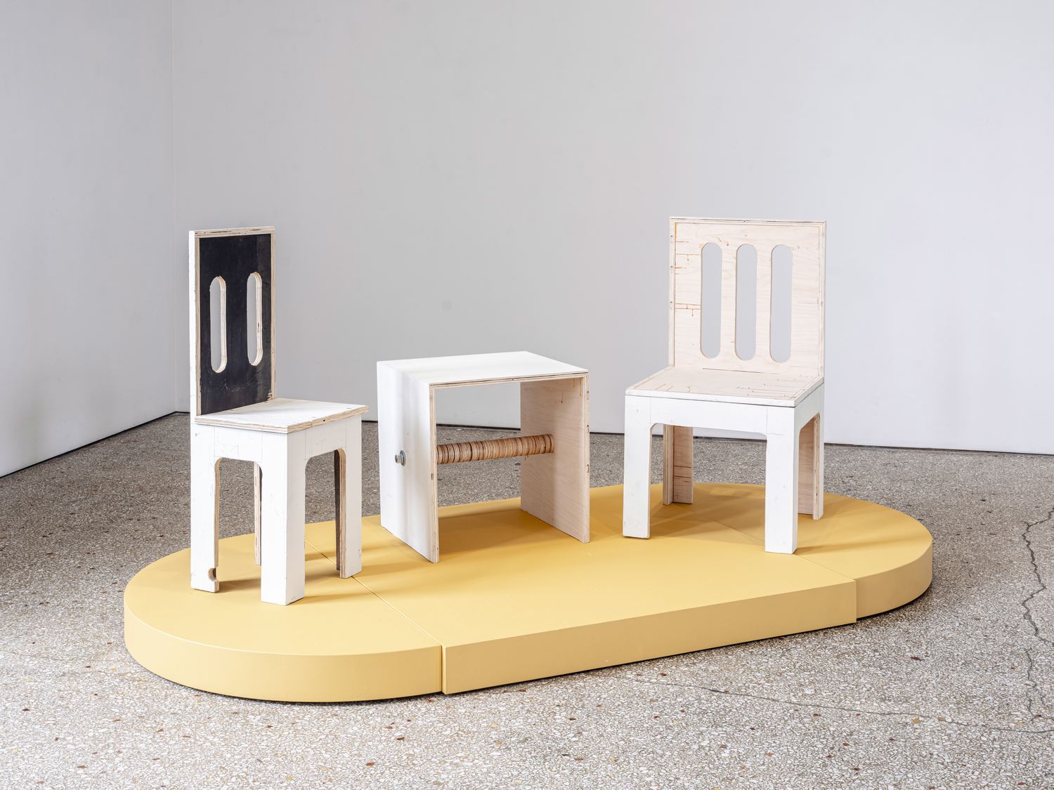 Justin Hodges, Gallery Furniture: painted chairs and a table on a yellow platform