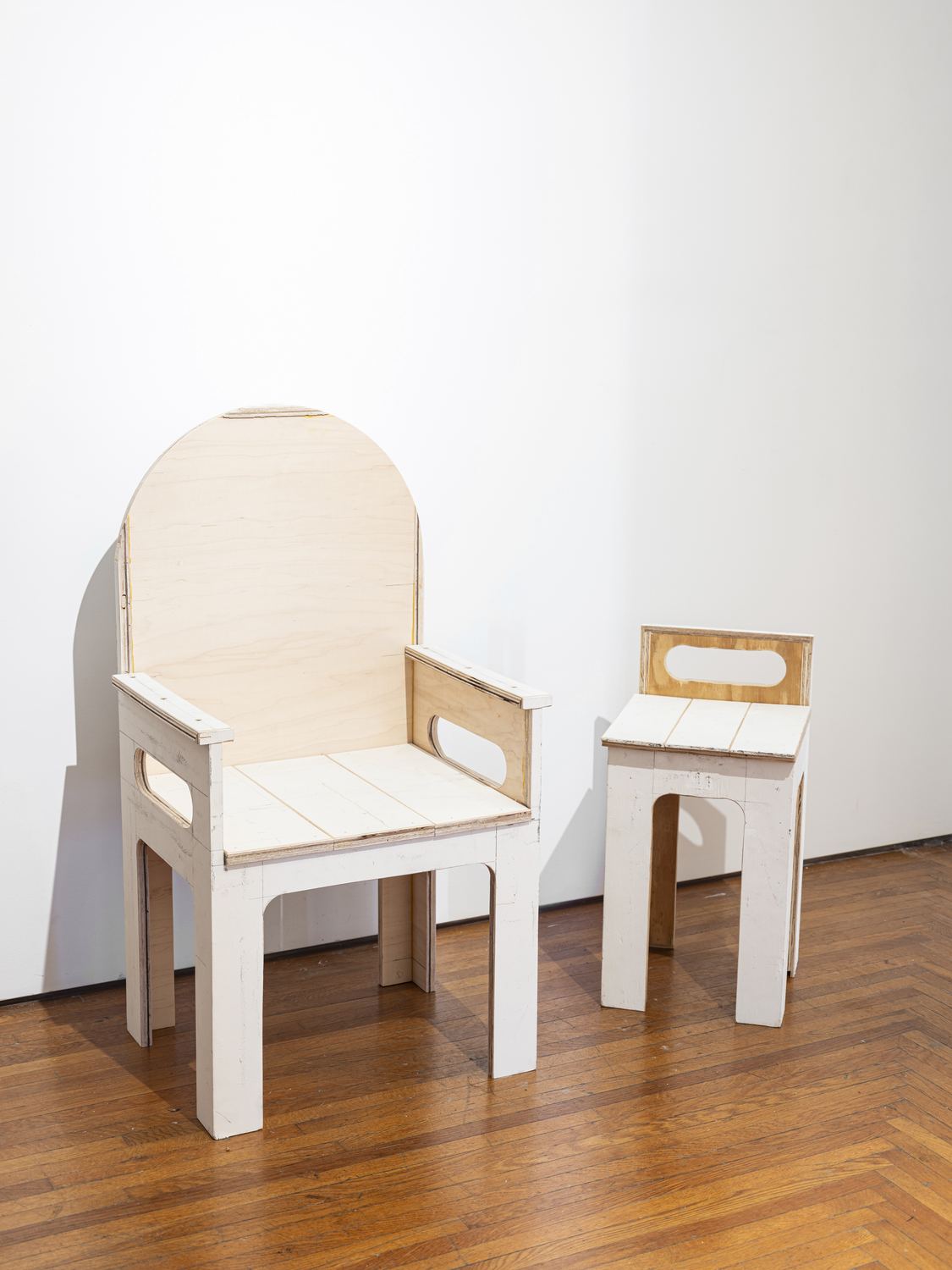 Justin Hodges, Gallery Furniture: two pale wooden chairs on a wood floor